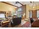 Spacious living room with brick fireplace, vaulted ceiling, and hardwood floors at 524 Deerberry Dr, Noblesville, IN 46062