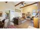 Inviting living room with hardwood floors, fireplace, and exposed ceiling beams at 524 Deerberry Dr, Noblesville, IN 46062