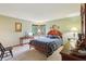 Cozy main bedroom with a sitting area in front of bay window and furniture at 524 Deerberry Dr, Noblesville, IN 46062