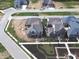 New construction homes in growing community feature modern designs with stone roofs and manicured lawns at 579 Exmoor Dr, Carmel, IN 46032