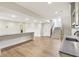 View of the finished basement with vinyl floors, a large entertaining area, and painted white walls at 579 Exmoor Dr, Carmel, IN 46032