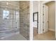 Modern bathroom shower with stylish tile work and glass enclosure at 579 Exmoor Dr, Carmel, IN 46032