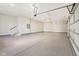 A clean, spacious garage with epoxy flooring, ready for vehicles and storage at 579 Exmoor Dr, Carmel, IN 46032