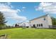 Expansive backyard featuring a lush green lawn, patio with outdoor seating, and ample space for recreation at 5876 E 126Th St, Carmel, IN 46033