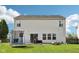 Large backyard with a well-maintained lawn, patio area, and various outdoor activities for relaxation and entertainment at 5876 E 126Th St, Carmel, IN 46033