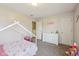 Spacious carpeted bedroom with a fun play area and ample closet space at 5876 E 126Th St, Carmel, IN 46033