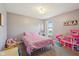 Bright bedroom featuring a large window, decor and fun play area at 5876 E 126Th St, Carmel, IN 46033