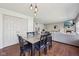 Inviting dining area with hardwood floors, modern lighting, and easy access to the living room at 5876 E 126Th St, Carmel, IN 46033