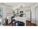 Bright kitchen with white cabinetry, an island, and modern appliances at 5876 E 126Th St, Carmel, IN 46033