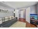 Cozy finished basement area features a comfortable couch, television, and easy access to the upper floors at 5876 E 126Th St, Carmel, IN 46033