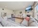 Bright and airy living room with a large sectional sofa, fireplace, and modern decor at 5876 E 126Th St, Carmel, IN 46033