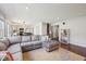 Spacious open-concept living and dining area featuring hardwood floors and modern decor at 5876 E 126Th St, Carmel, IN 46033