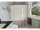 Bright bathroom with a window and shower curtain at 601 Ridgeview Ln, Columbus, IN 47201