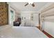 Bedroom with wood floors, ceiling fan, and natural light at 601 Ridgeview Ln, Columbus, IN 47201