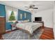 Bedroom featuring a ceiling fan, area rug, and natural light at 601 Ridgeview Ln, Columbus, IN 47201