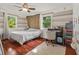 Bright bedroom with ceiling fan, wood floors, windows and lots of light at 601 Ridgeview Ln, Columbus, IN 47201
