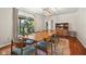 Dining room with hardwood floors, colorful rug, and large window at 601 Ridgeview Ln, Columbus, IN 47201