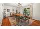 Dining room with hardwood floors, colorful rug, and bright natural light at 601 Ridgeview Ln, Columbus, IN 47201