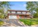Charming two-story brick home with attached garage and well-maintained lawn in a tranquil neighborhood at 601 Ridgeview Ln, Columbus, IN 47201