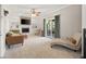 Comfortable living room featuring a fireplace with built-in shelving and sliding doors to a covered patio at 601 Ridgeview Ln, Columbus, IN 47201