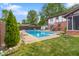Enjoy the privacy of this inground pool with a well-maintained yard and charming brick house exterior at 601 Ridgeview Ln, Columbus, IN 47201
