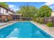 Beautiful backyard showcasing a private pool, fenced yard, and outdoor seating, creating a serene retreat at 601 Ridgeview Ln, Columbus, IN 47201