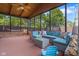 Inviting sunroom with comfortable seating, offering a relaxing view of the backyard and lush surroundings at 601 Ridgeview Ln, Columbus, IN 47201