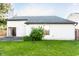 View of a backyard with grass, vinyl siding, and a concrete patio at 6140 King Lear Ln, Indianapolis, IN 46254