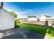 Fenced backyard with a well-maintained lawn and patio area, ideal for outdoor entertaining at 6140 King Lear Ln, Indianapolis, IN 46254