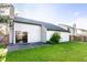 Backyard with grass, concrete patio and wood privacy fence at 6140 King Lear Ln, Indianapolis, IN 46254