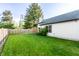Manicured lawn in the backyard with wooden fence at 6140 King Lear Ln, Indianapolis, IN 46254