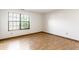 Bright bedroom featuring hardwood floors and a large window at 6140 King Lear Ln, Indianapolis, IN 46254