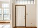Bright foyer with natural light and a view to the living area at 6140 King Lear Ln, Indianapolis, IN 46254