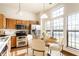 Cozy kitchen with an adjacent dining area bathed in natural light at 6140 King Lear Ln, Indianapolis, IN 46254