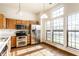 Well-lit kitchen with stainless steel appliances and ample cabinet space at 6140 King Lear Ln, Indianapolis, IN 46254