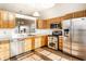 Functional kitchen with stainless steel appliances and plenty of counter space at 6140 King Lear Ln, Indianapolis, IN 46254