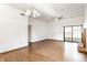 Bright living room with hardwood floors, fireplace, and sliding glass door to the outside at 6140 King Lear Ln, Indianapolis, IN 46254