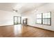 Spacious living room with a cozy fireplace and access to the backyard at 6140 King Lear Ln, Indianapolis, IN 46254