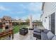 Landscaped backyard featuring a patio set and a play structure at 6164 Brighton Dr, Whitestown, IN 46075