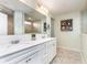 Bright bathroom featuring double sinks, white cabinets, and tile flooring at 6164 Brighton Dr, Whitestown, IN 46075