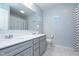 Bathroom featuring double vanity, large mirror, tile floor, and a shower with decorative curtain at 6164 Brighton Dr, Whitestown, IN 46075