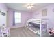 Bedroom with carpet featuring neutral walls, complemented by a white bunk bed and vanity at 6164 Brighton Dr, Whitestown, IN 46075
