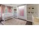 Cozy Bedroom with a crib, built-in bookshelves, and soft natural light at 6195 Woodmill Dr, Fishers, IN 46038
