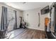 Bright exercise room features modern equipment and natural light from a window with gray curtains at 6195 Woodmill Dr, Fishers, IN 46038