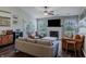 Inviting living room with a fireplace, neutral paint, stylish decor, and access to the backyard at 6195 Woodmill Dr, Fishers, IN 46038