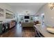 Bright living room with vaulted ceilings, a cozy fireplace, modern furniture and hardwood floors at 6195 Woodmill Dr, Fishers, IN 46038
