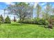 Expansive backyard featuring a lush lawn, mature trees, and well-maintained landscaping at 621 Thorne Dr, Brownsburg, IN 46112