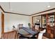 Cozy dining room features a wood table, chairs, wood floors, and a dark wood hutch at 621 Thorne Dr, Brownsburg, IN 46112
