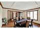 Elegant dining room with wood floors, large table, and stylish decor at 621 Thorne Dr, Brownsburg, IN 46112