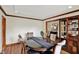 Traditional dining room features a wood table, chairs, wood floors, and a dark wood hutch at 621 Thorne Dr, Brownsburg, IN 46112